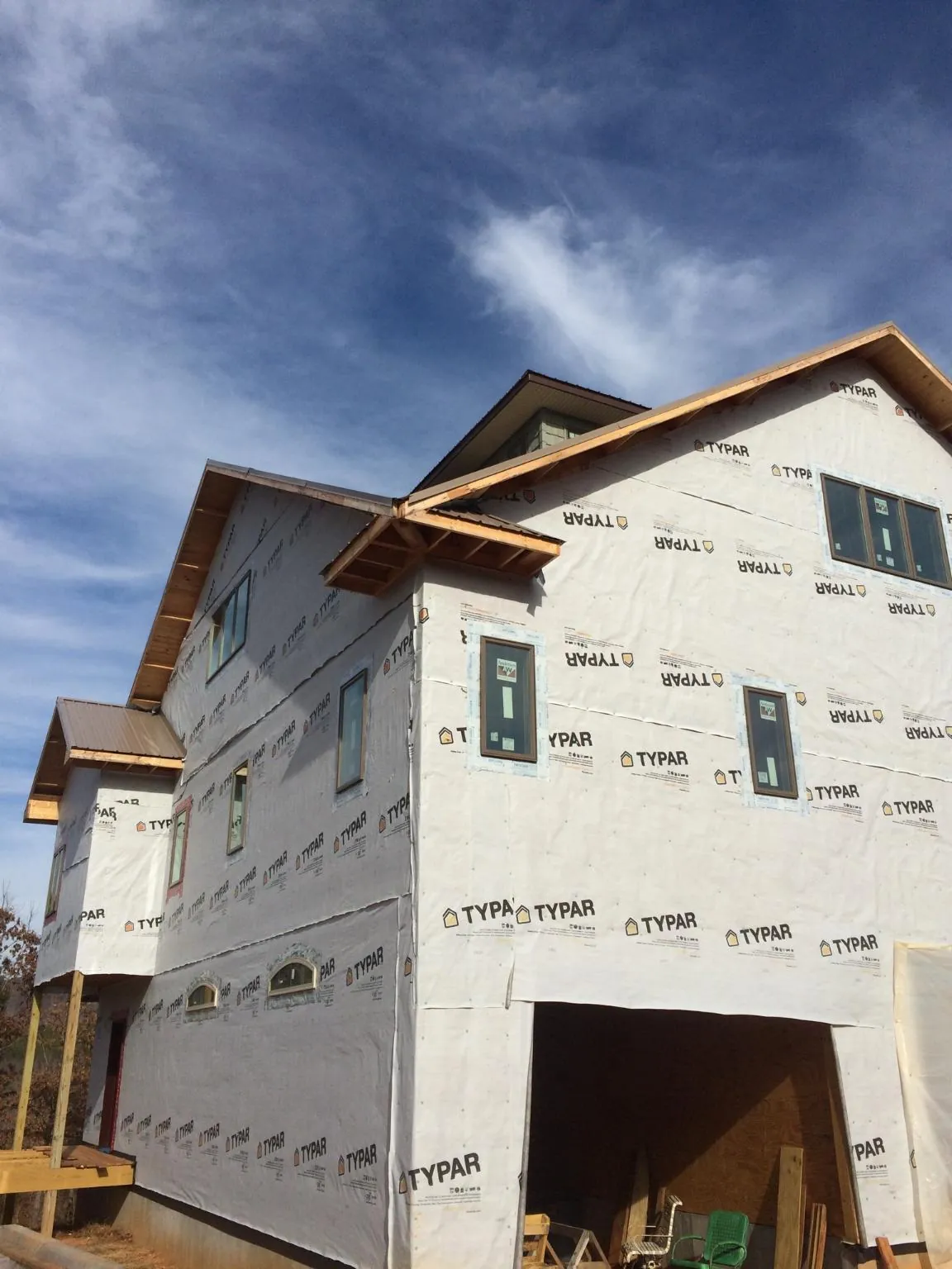 Stick built house wrapped in Typar with new roof framing and dormers in Golden